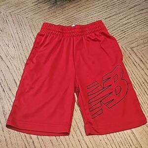 Red athletic shorts New Balance size M 5/6